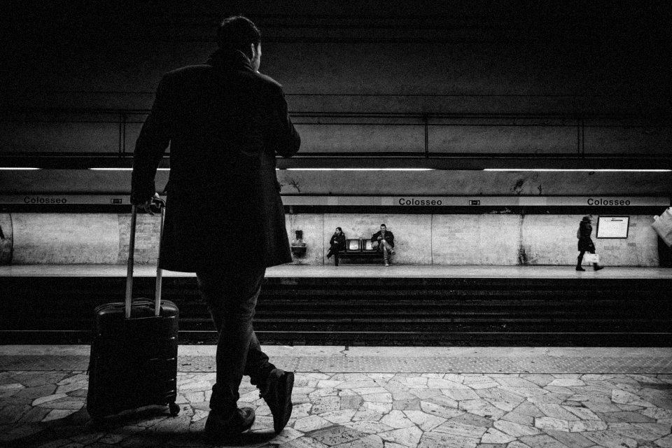 Man With Luggage Bag On Train Station