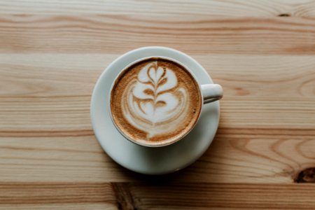 Coffee In White Ceramic Teacup On White Ceramic Suacer