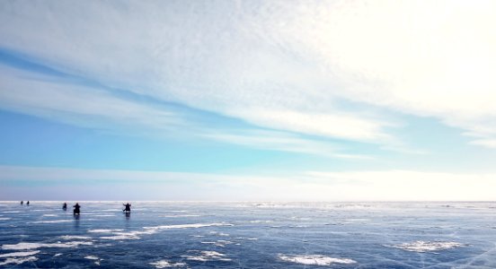 Photo Of Five People On Ice Field photo