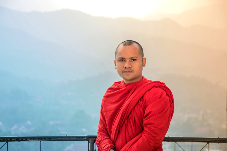 Man In Red Traditional Dress Under White And Blue Sky
