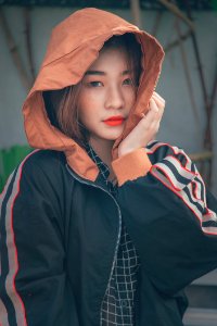 Woman In Black And Orange Zip-up Hoodie