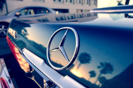 Close Up Photography Of Chrome Mercedes-benz Car Emblem photo