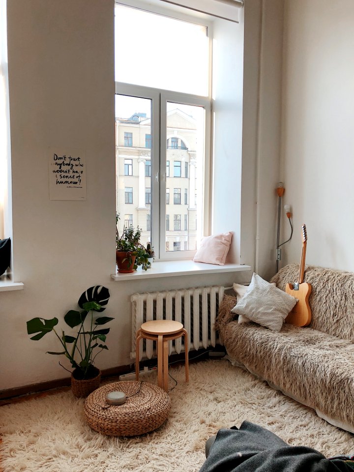 Round Brown Wooden Stool Near Brown Sofa photo