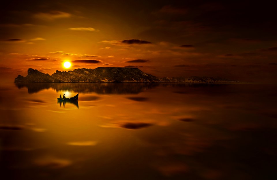 Twp People Riding Boat In Sunset Photo