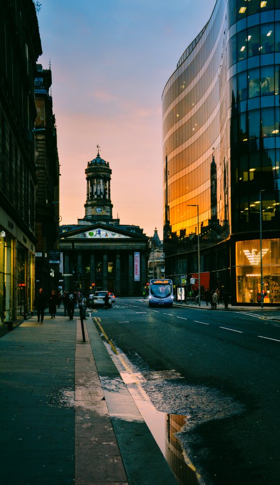 People Walking At Sidewalk During Sunset photo