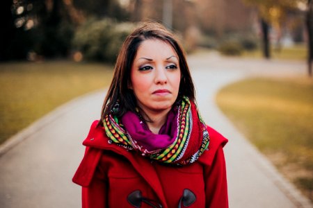 Woman Wearing Red Coat And Scarf photo