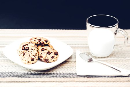 Photo Of Clear Mug Beside Plate With Cookies photo