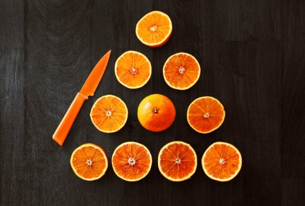Sliced Orange Fruit With Knife