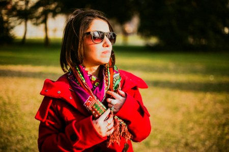Woman In Red Coat With Black Sunglasses