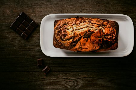 Chocolate Cake In White Plate Beside Chocolate Bars