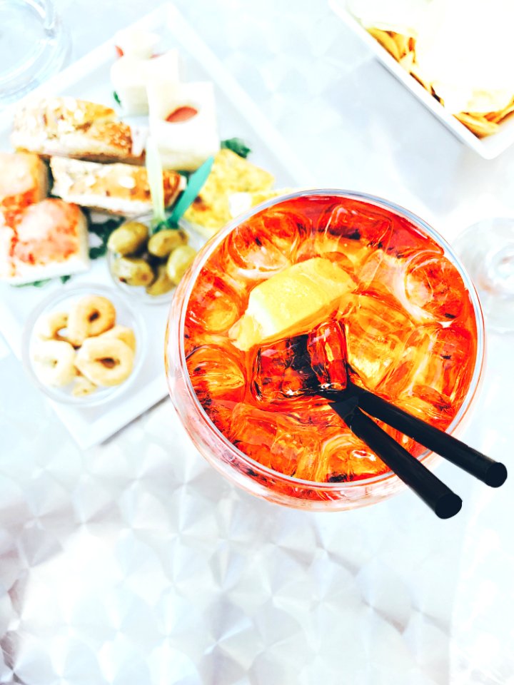 Photo Of Clear Drinking Glass Filled With Liquid Beside Food On Table