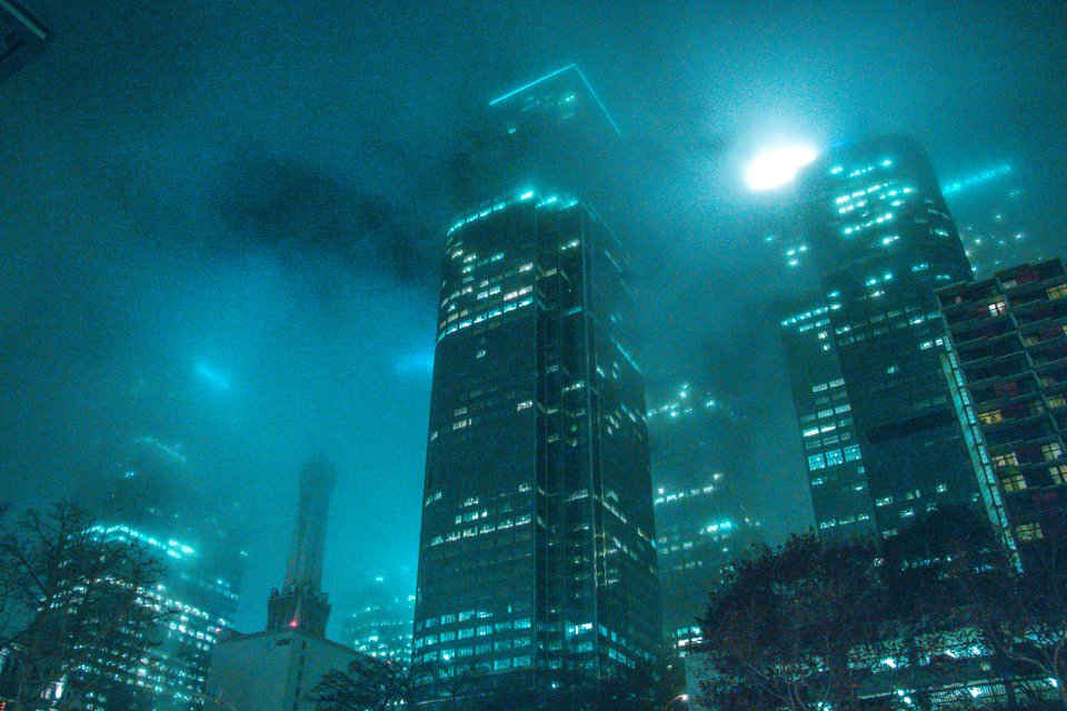 High-rise Building Beside Buildings During Night