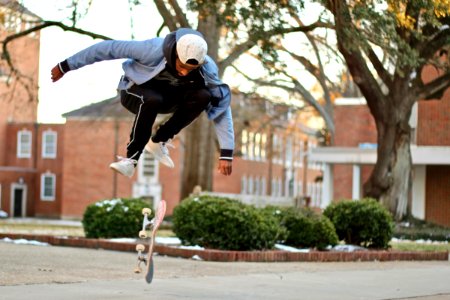 Man Jumps Over Skateboard