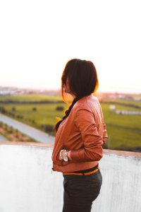 Side View Of Woman Wearing Brown Leather Jacket