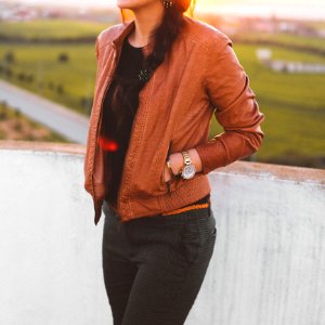 Woman Wearing Brown Leather Jacket And Black Pants photo