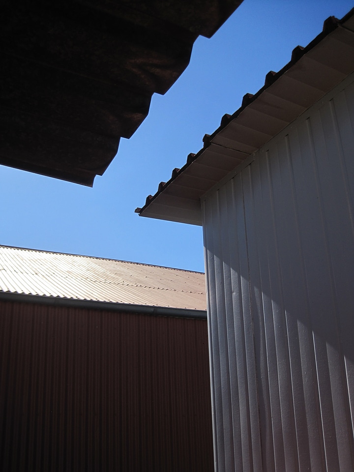 Corrugated sun and shade blue sky