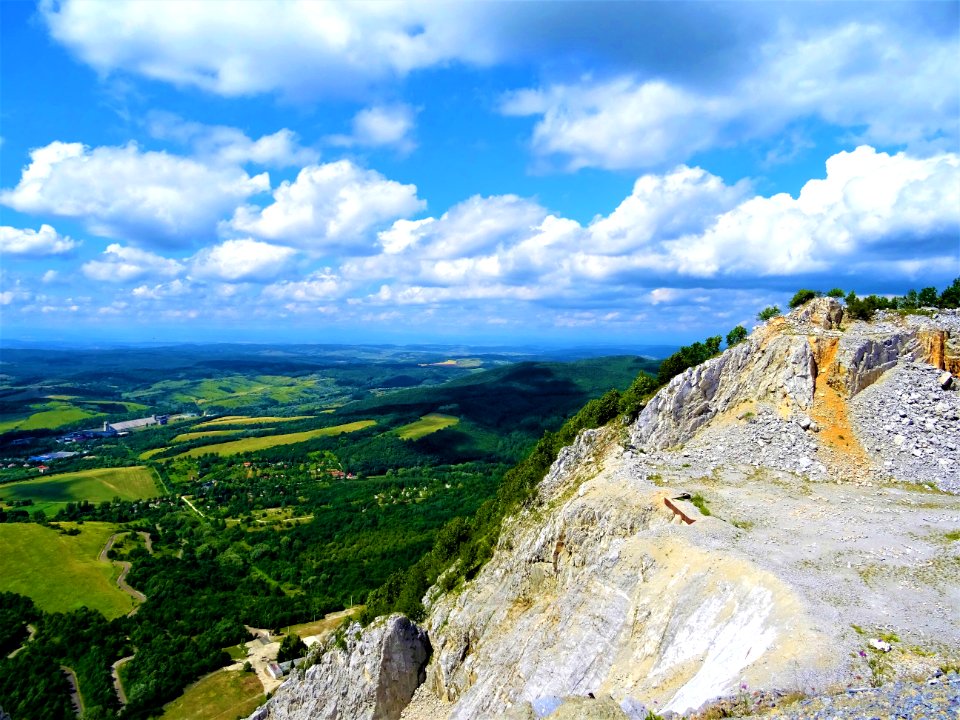 Mountain Near Green Leaf Trees Under White Cloudy Sky photo