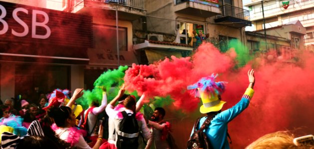 People Spraying Assorted Color Of Smoke photo