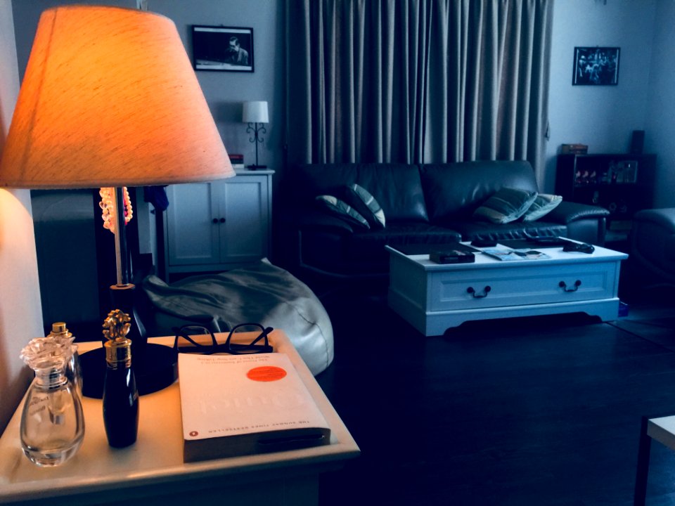 Black Table Lamp Base With Cone-shaped Brown Lampshade On Brown Wooden Nightstand