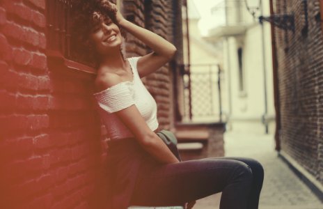 Woman Wearing White Off-shoulder Shirt And Blue Denim Jens photo