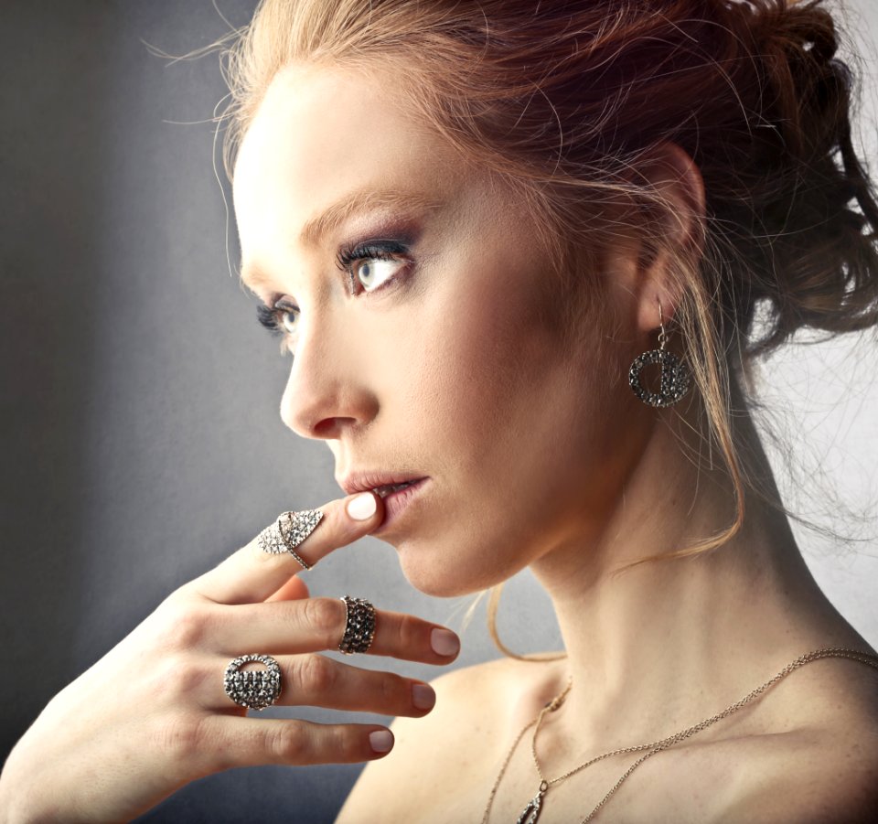 Woman Wearing Rings And Earrings
