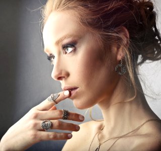 Woman Wearing Rings And Earrings