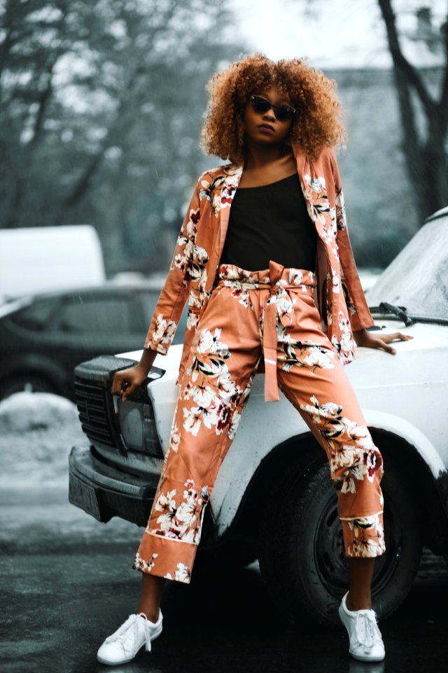 Woman Wearing Brown-and-white Cardigan With Matching Pants Sitting In White Vehicle