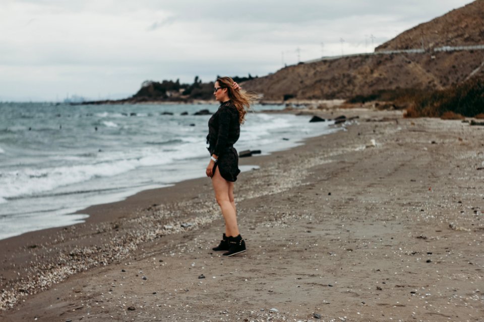 Woman Standing On Seashore