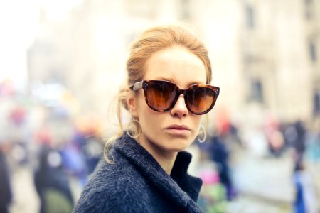 Woman Wearing Black-framed Sunglasses photo