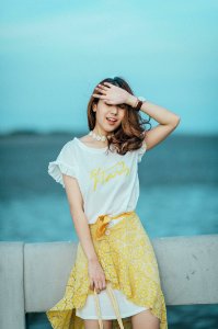 Woman Wearing White And Yellow Scoop-neck Mini Dress photo