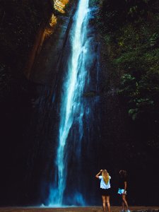 Two Women Near Waterfalls
