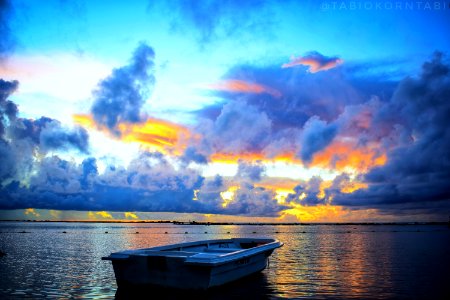 Blue White And Orange Skies During Sunset photo