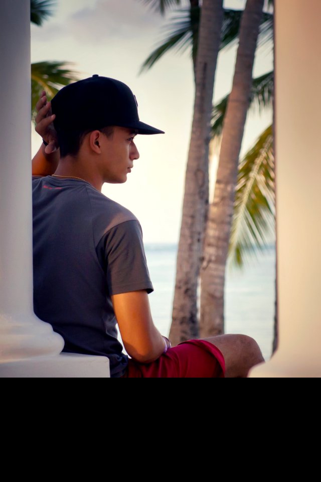 Man In Gray Crew-neck T-shirt And Black Snapback Cap