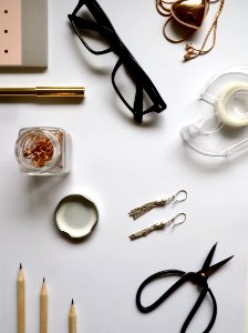 Top-view Photography Of White Wooden Table With Personal Accessories On Top photo