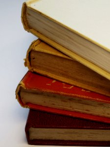 Four Assorted-color Hardbound Books