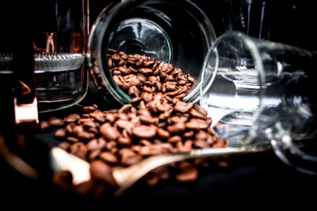 Coffee Beans Spoiling On Clear Glass Jar Near Clear Glass Mug