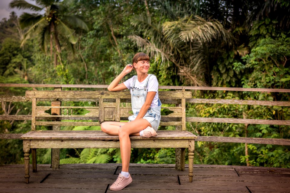 Woman Sitting On Brown Wooden Chair