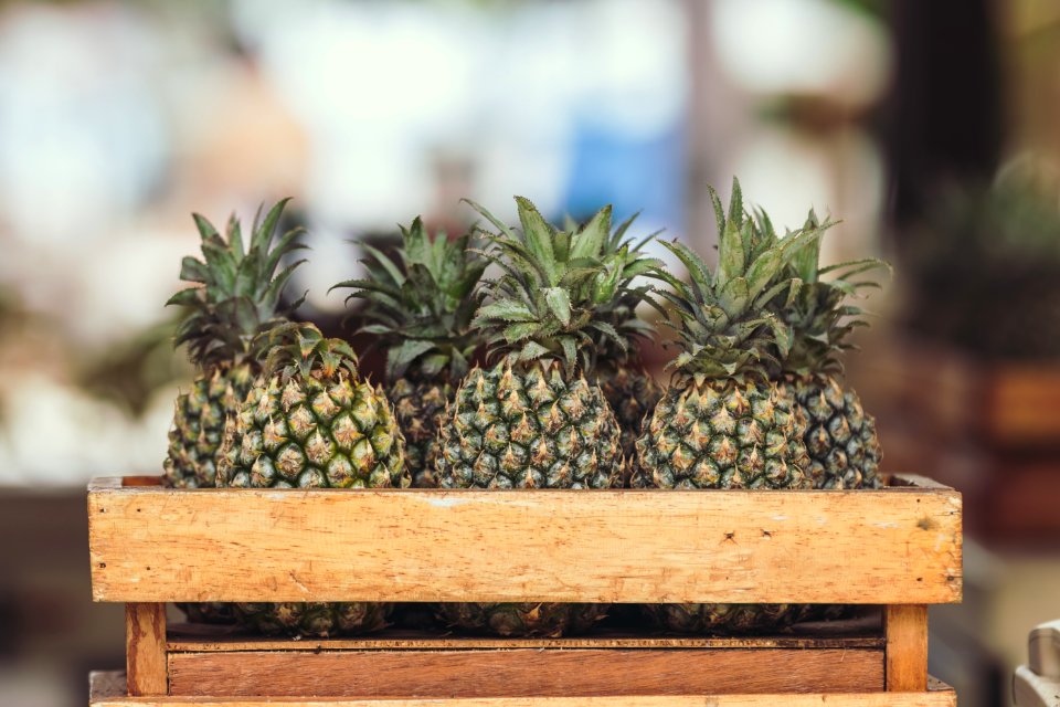 Pineapple Fruits On Wooden Crate