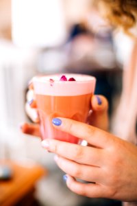 Selective Focus Photo Of Person Holding Cup