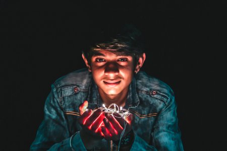 Man Holding White String Light Photo photo