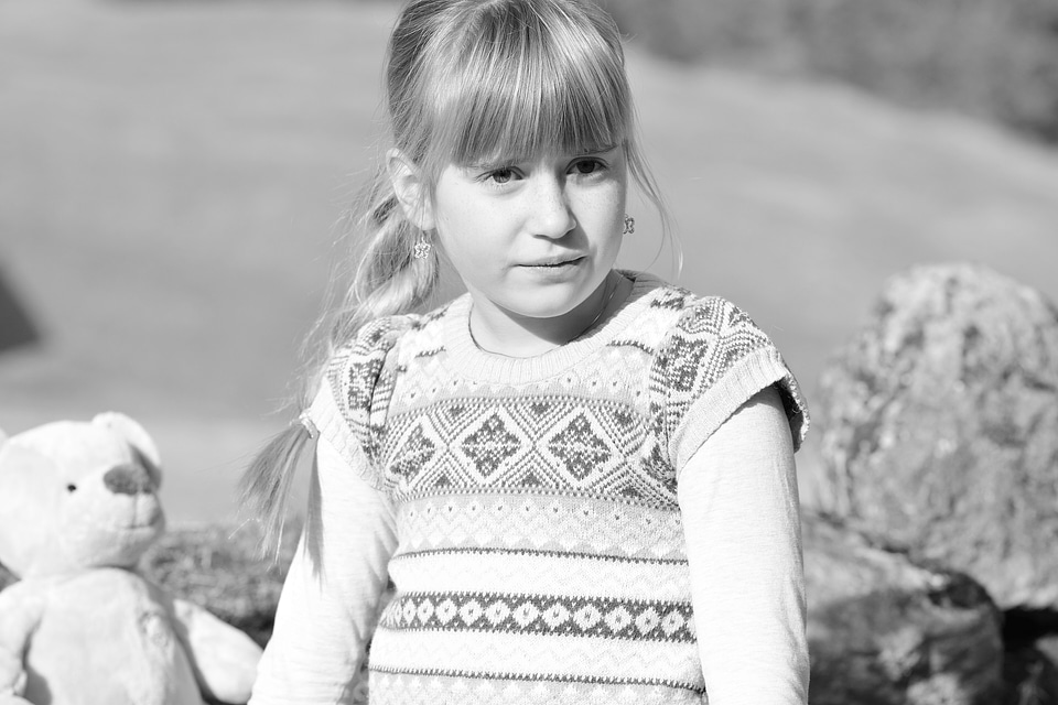 Girl teddy bear nature