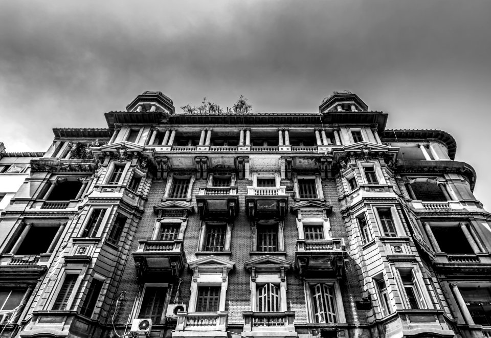 Low-angle And Grayscale Photo Of Concrete Building photo