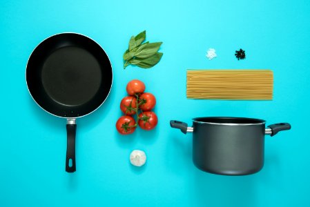 Black And Gray Cooking Pot And Frying Pan With Tomatoes