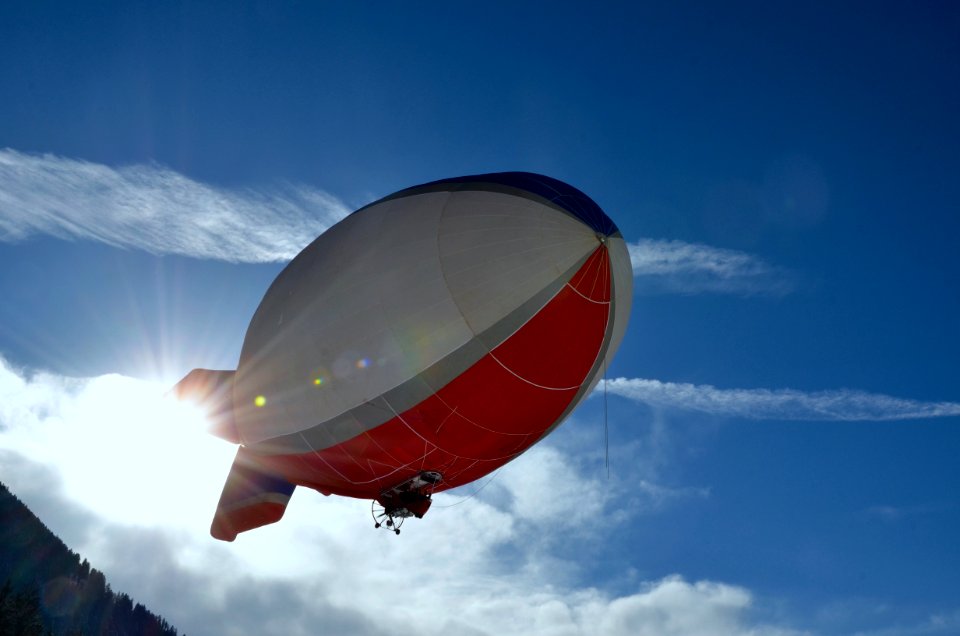 White And Red Blimp Flying