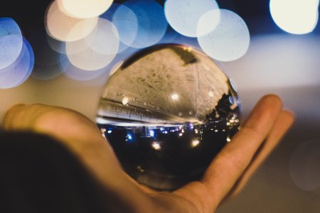 Crystal Ball On Persons Hand