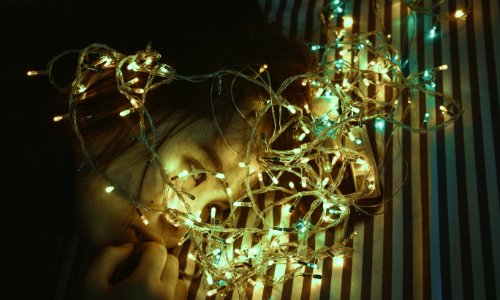 Woman Near Assorted-color String Lights photo