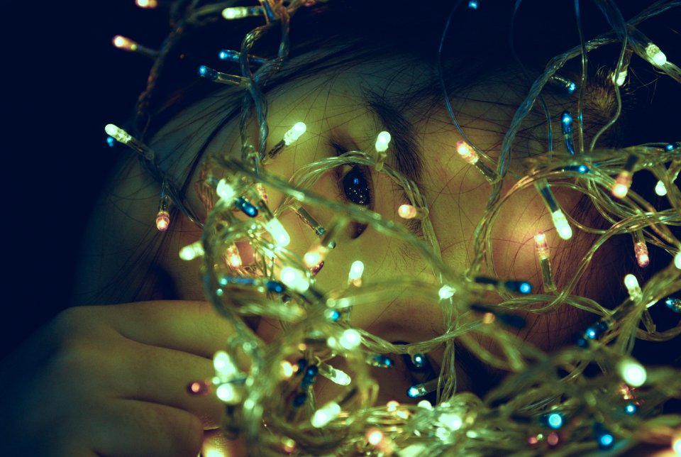 Girl Facing Turned On String Light