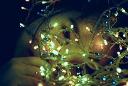 Girl Facing Turned On String Light photo