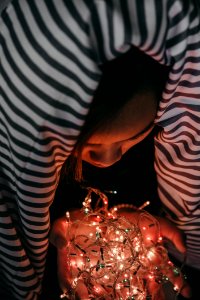 Woman Holding White String Lights photo