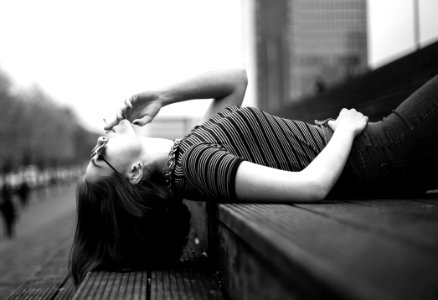 Woman Laying On Stairway Grayscale Photo photo